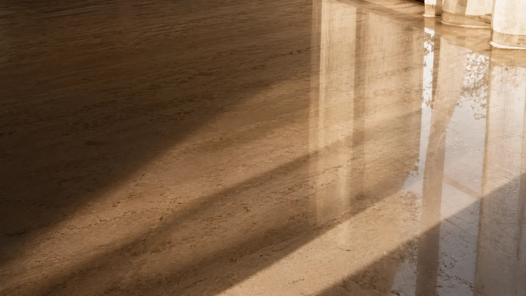 Polished marble floor reflecting Mallorcan light.